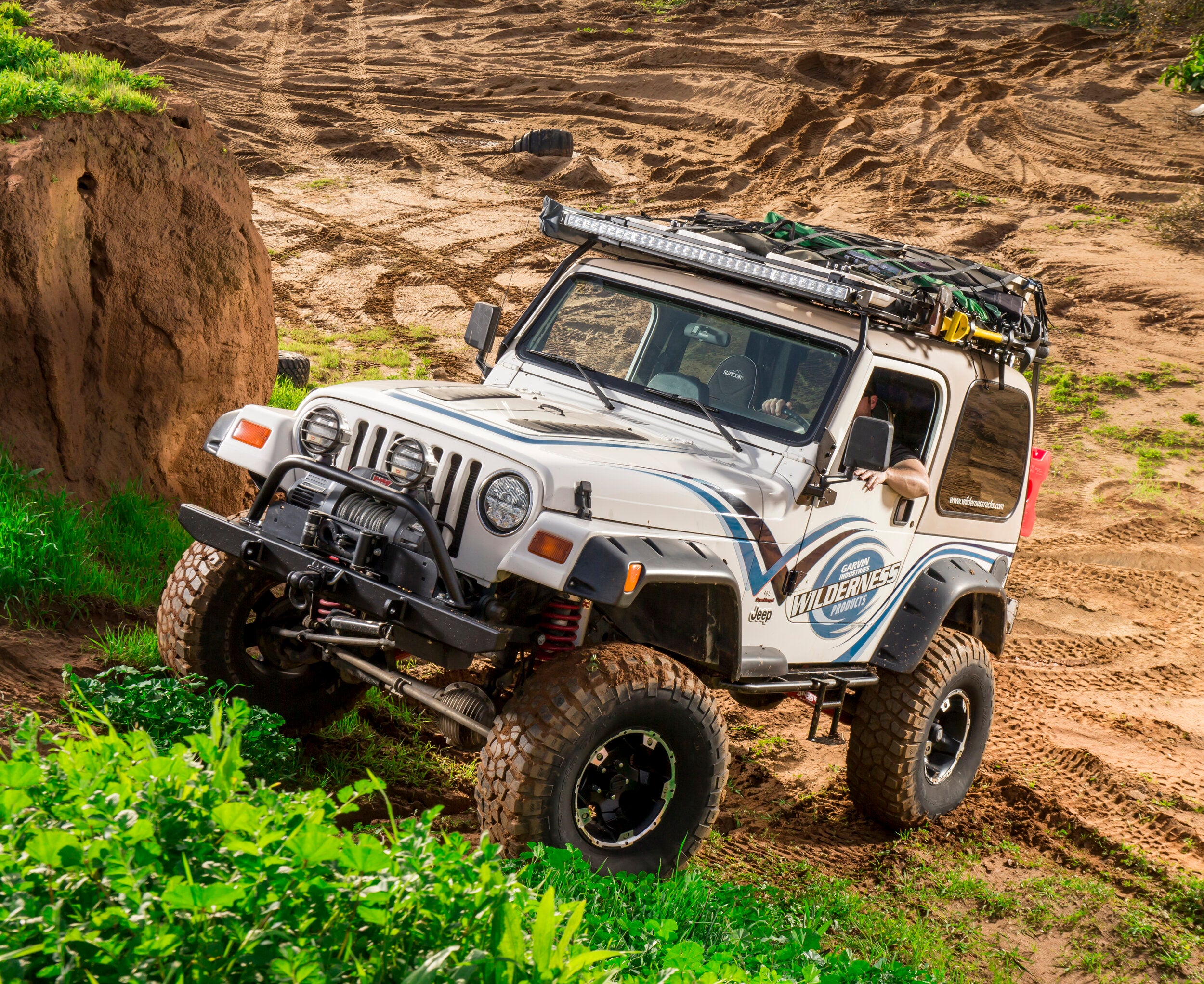 Chris Garvin In His Jeep Wrangler TJ with expedition Roof rack and 50 inch light bar in nature